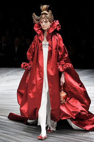 red silk oversized cape and white dress