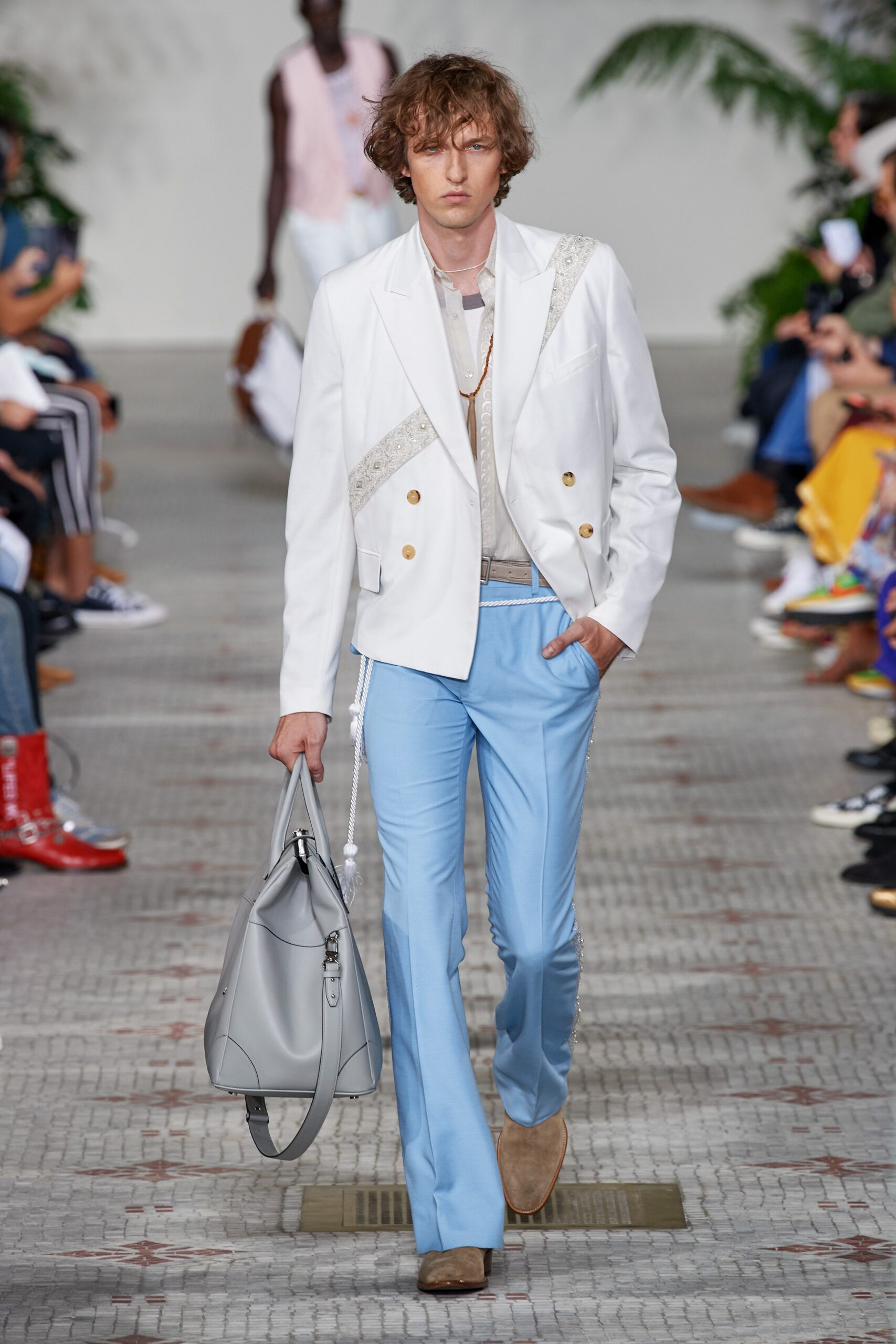 white tailored blazer and blue flared pants
