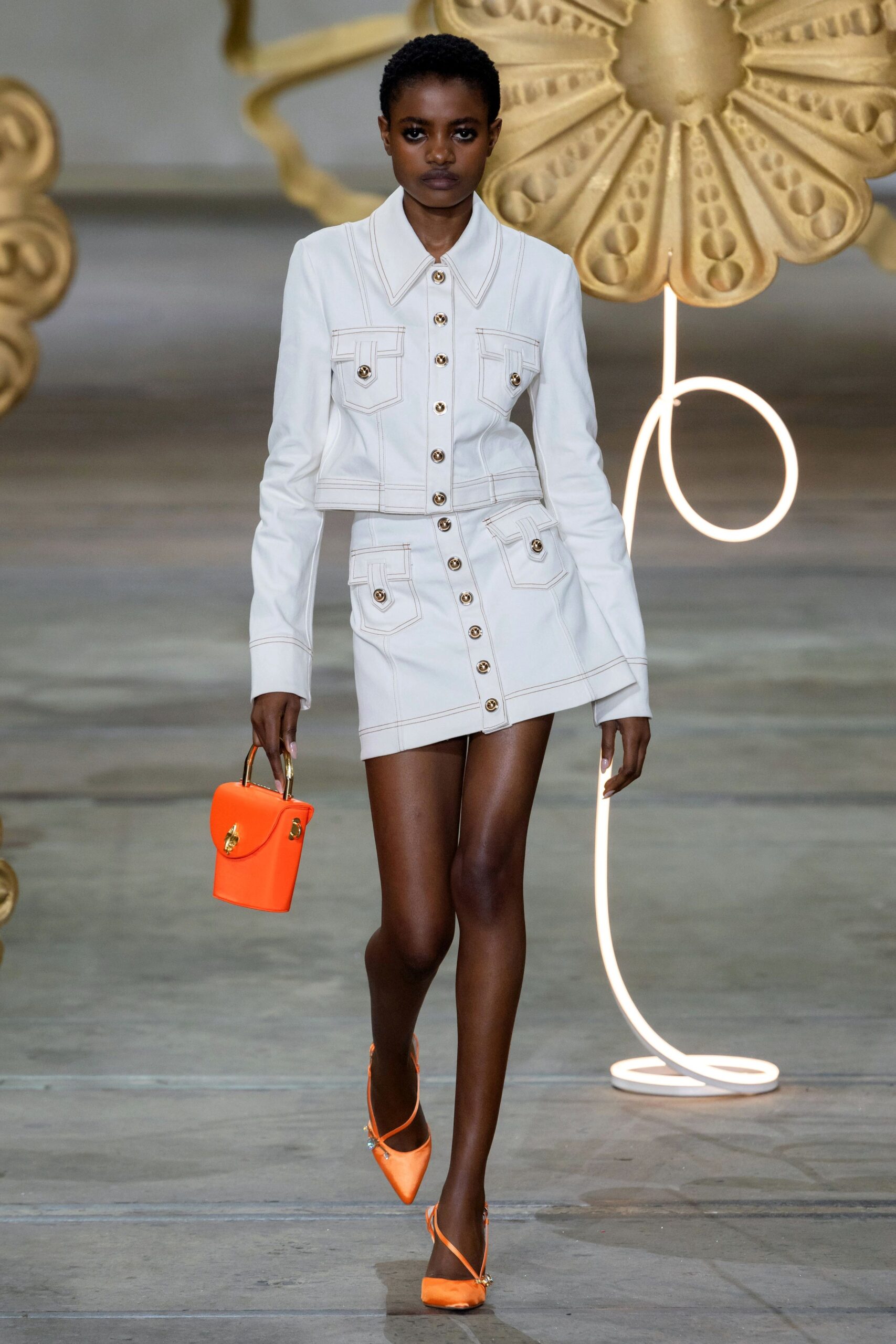 white fitted jacket and mini skirt