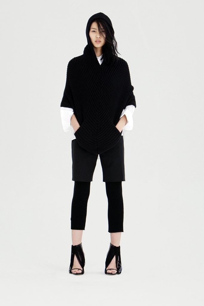 black poncho with shorts and leggings