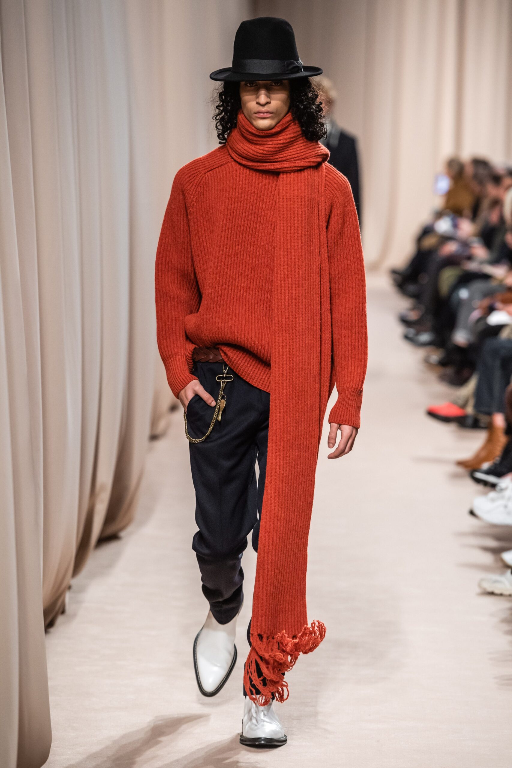 red wool sweater with navy pants