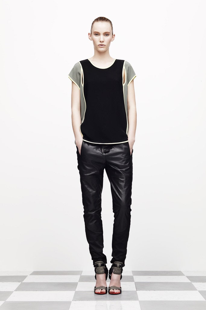 black and green fitted top with leather pants