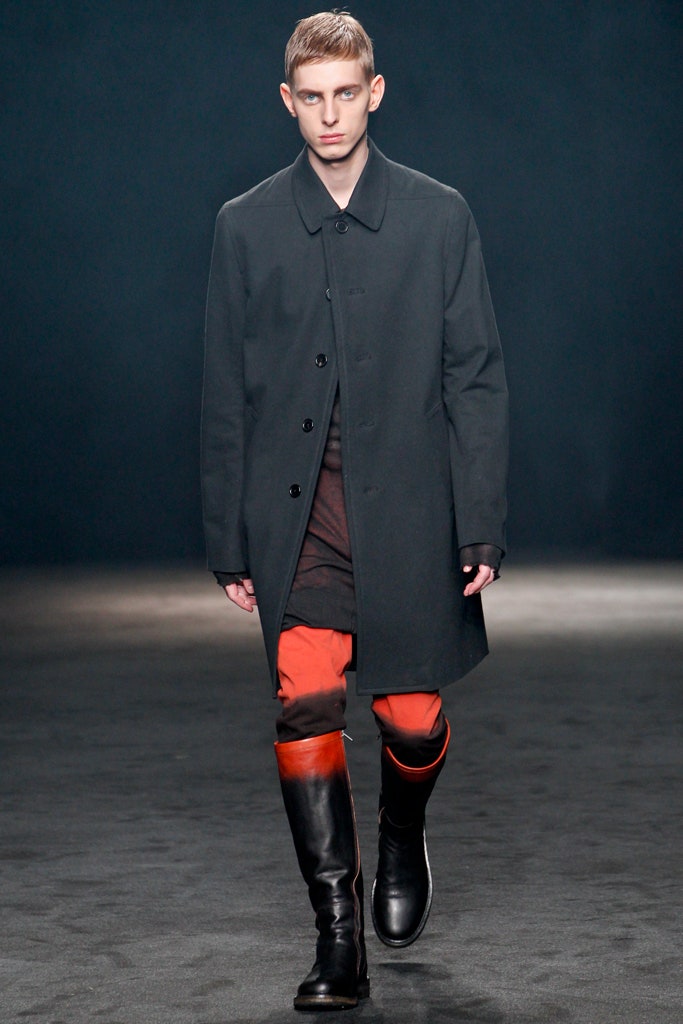 black wool coat with orange pants