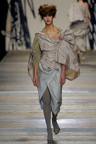beige silk fitted dress with gray cape