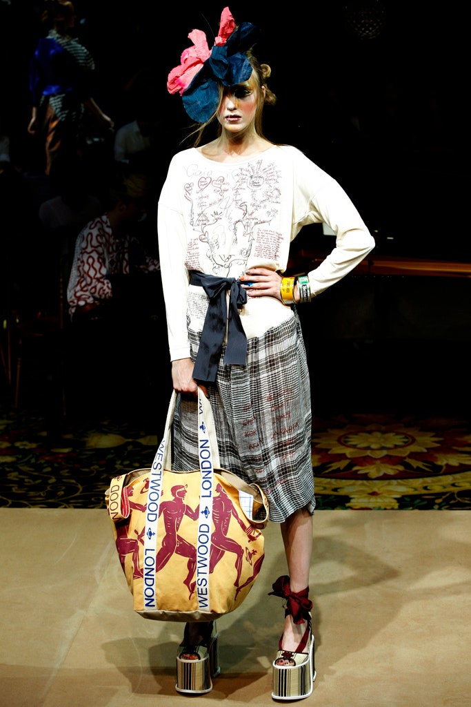 relaxed white printed top with gray pleated skirt