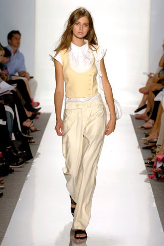 beige vest white blouse relaxed pants