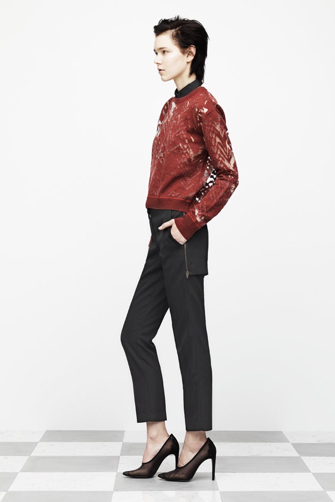 red printed sweater with tailored pants