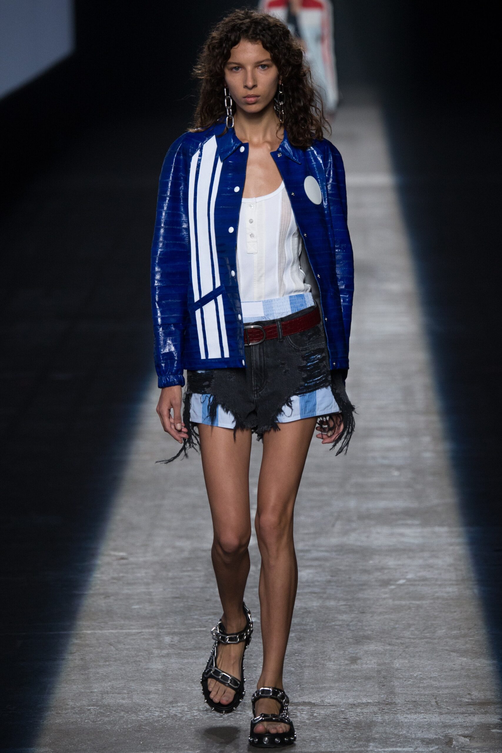 blue vinyl jacket with white shirt