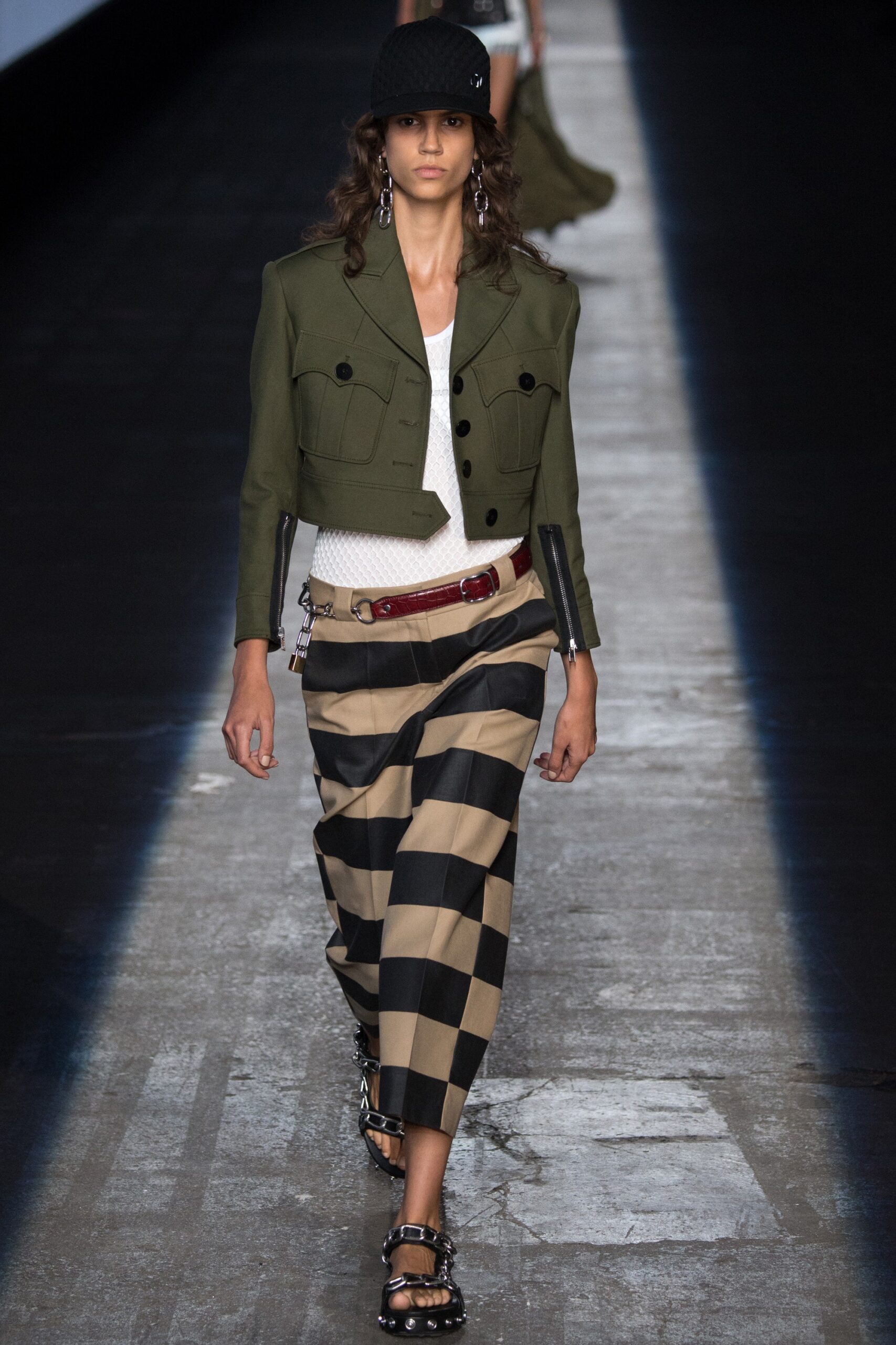 green fitted jacket with checked skirt