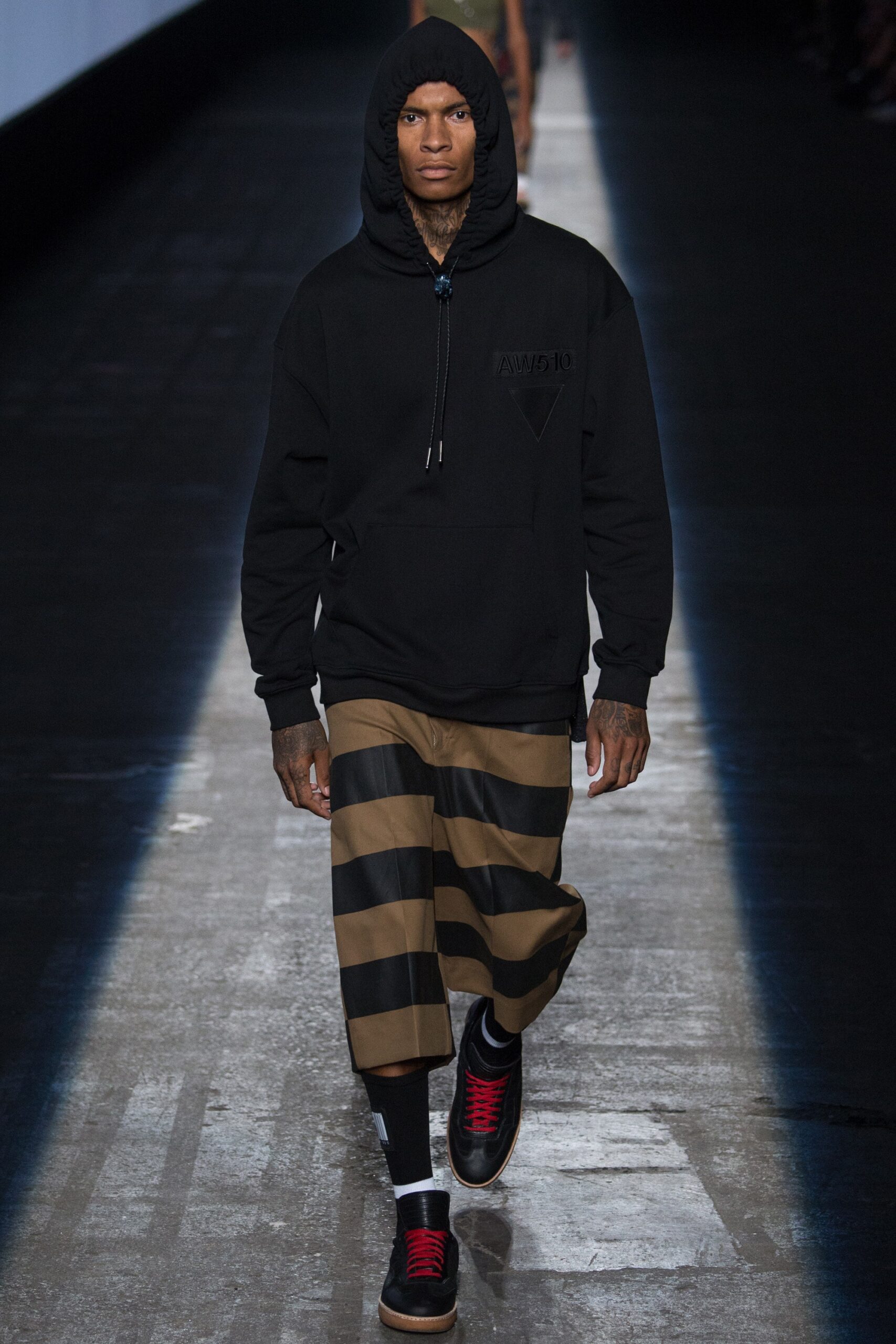 black hoodie and striped pants