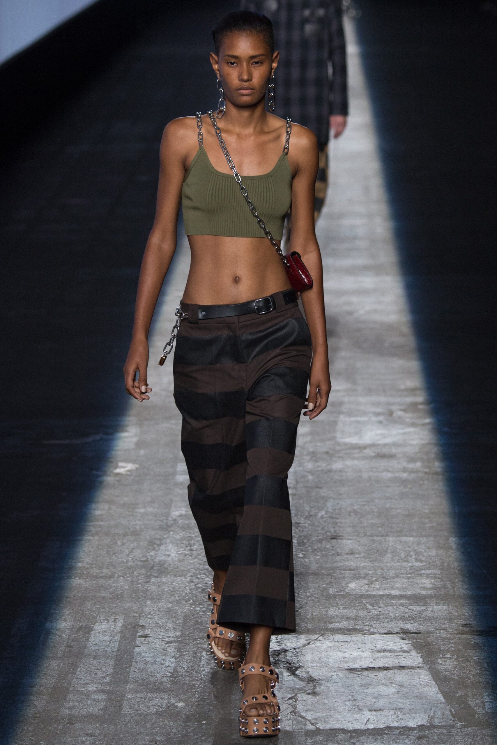 green fitted top black striped pants