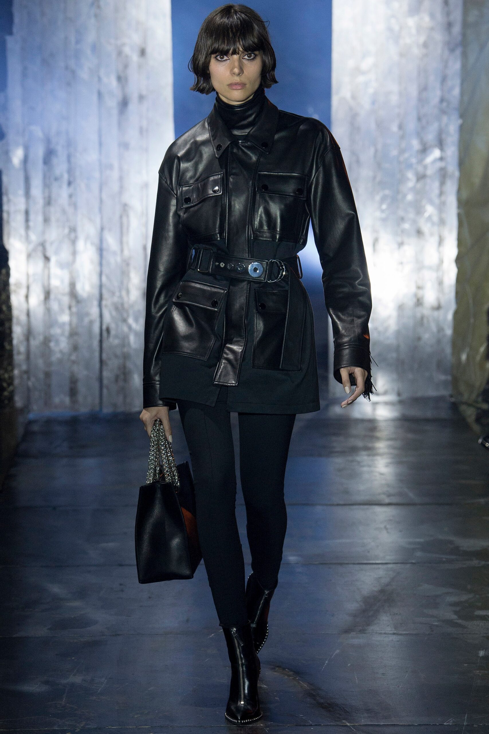 black leather long-sleeve collared fitted zippered belted jacket
