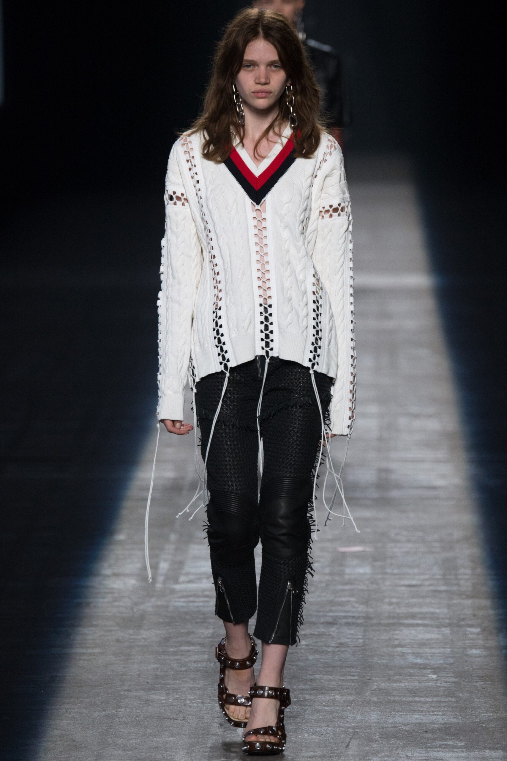 white relaxed sweater and black leather pants