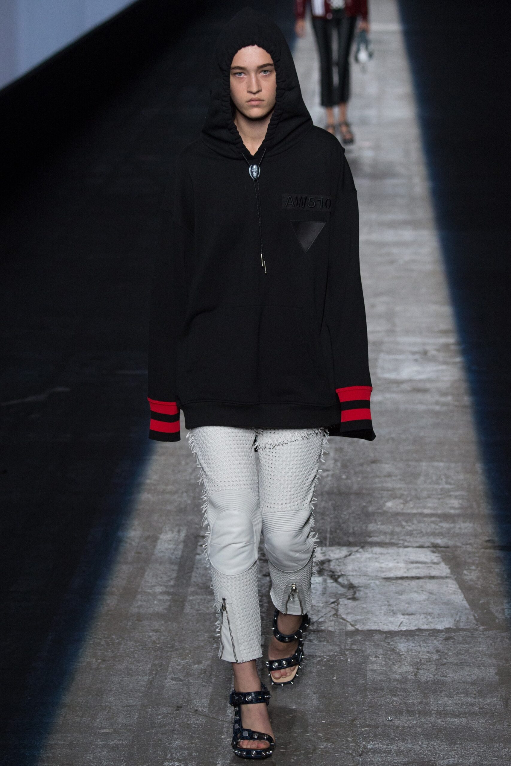 black oversized hoodie and white pants