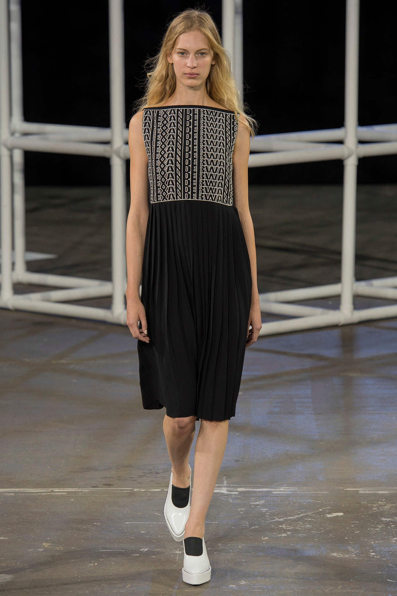black pleated sleeveless dress