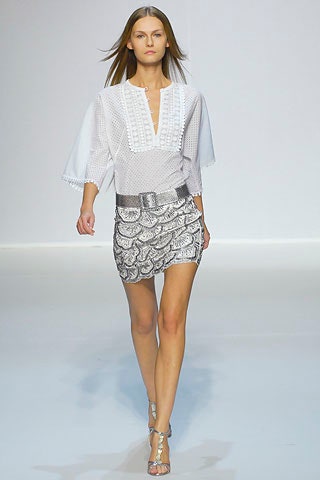 white fitted blouse with silver skirt