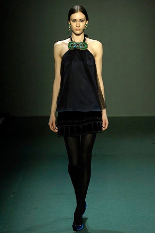 black silk sleeveless top and pencil skirt