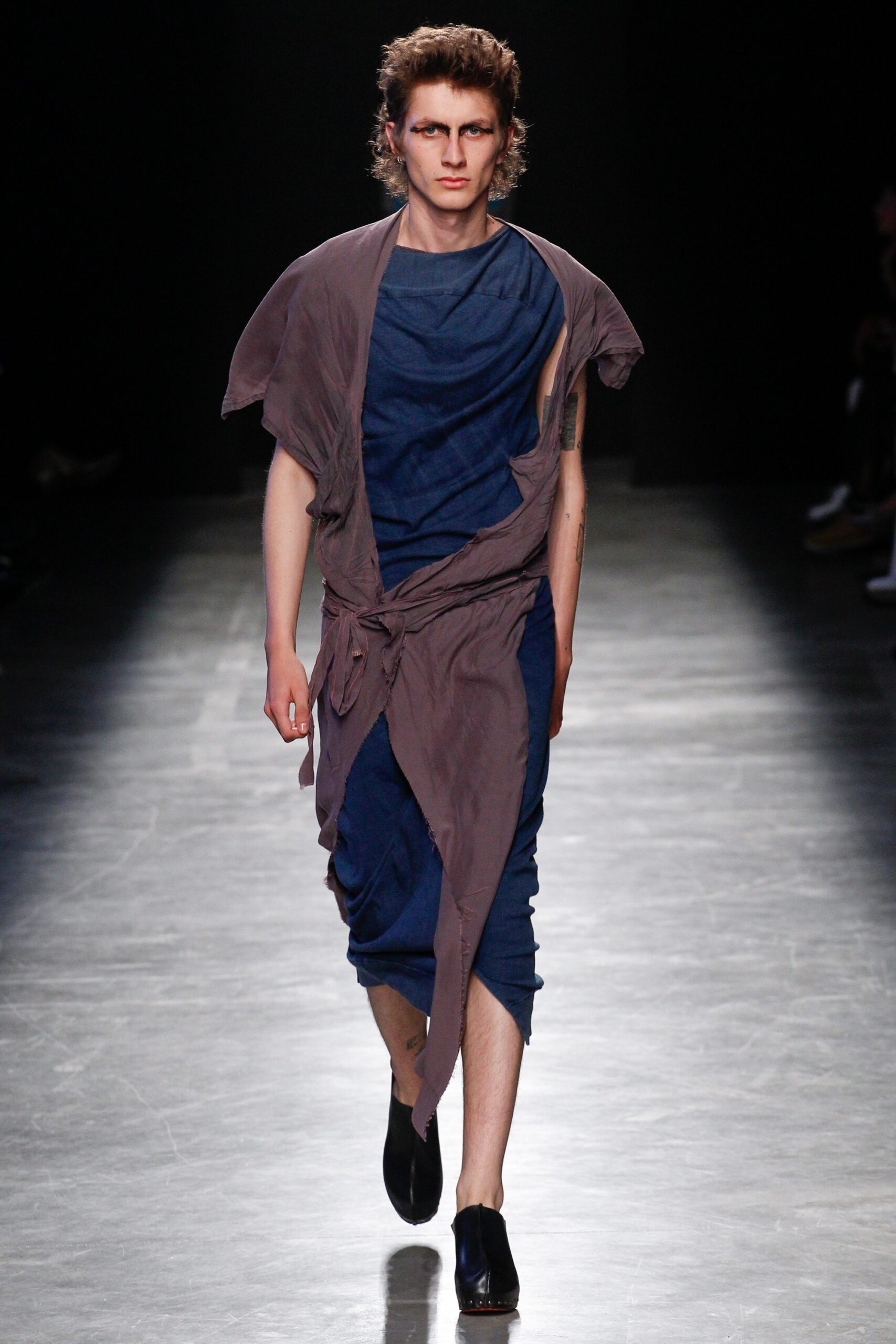 blue fitted midi dress with brown cape