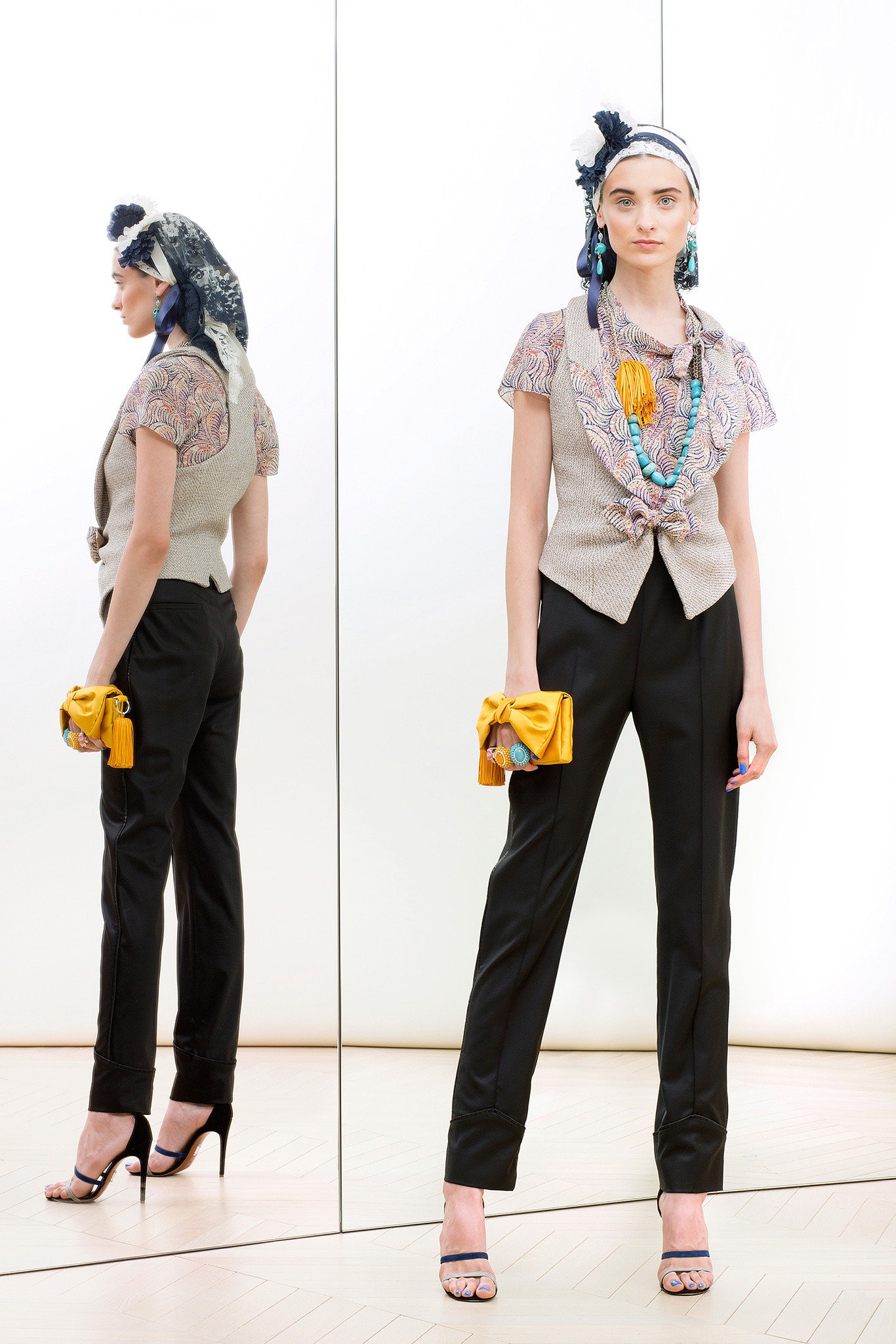 beige embroidered top with black pants