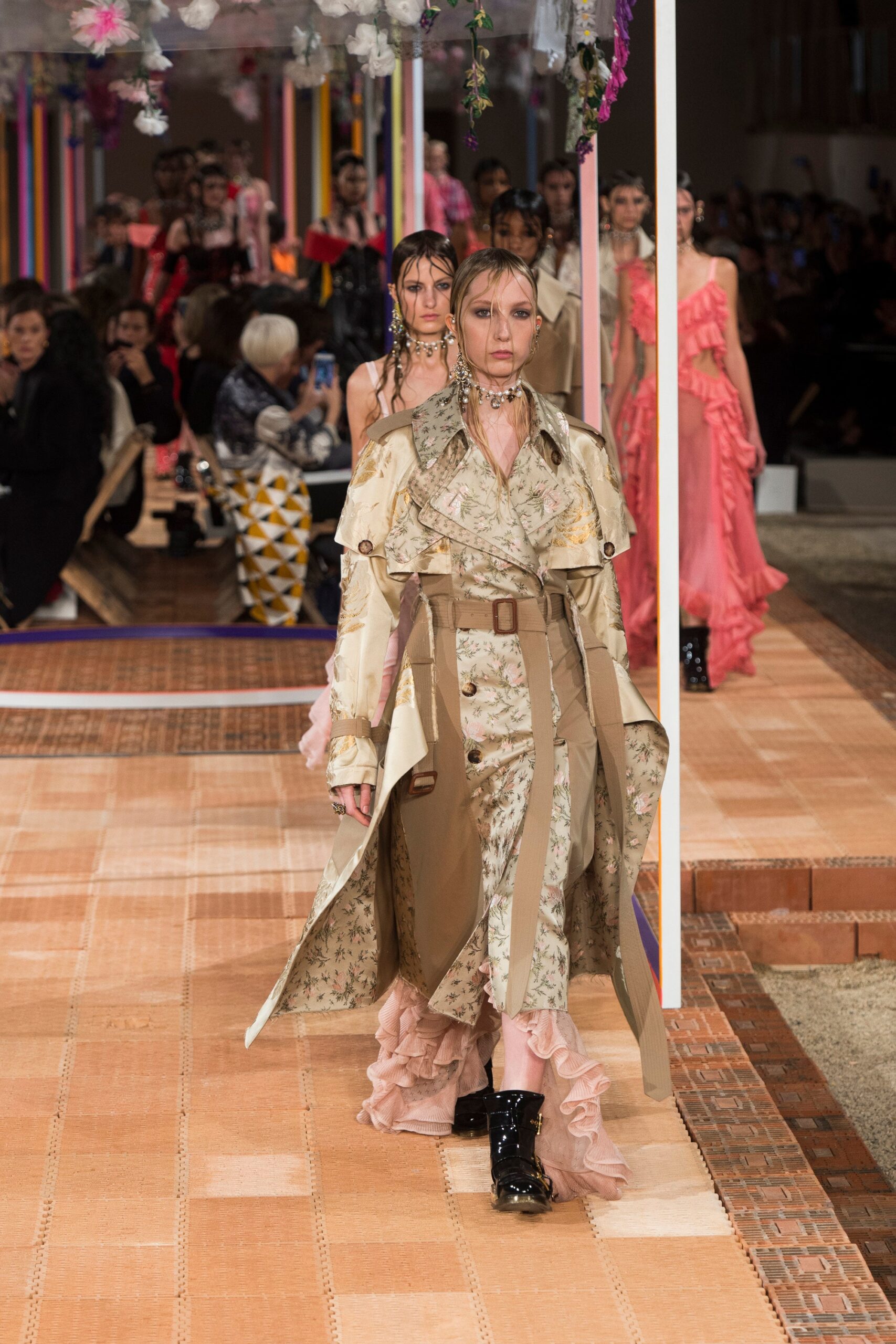 beige floral trench and pink ruffled dress