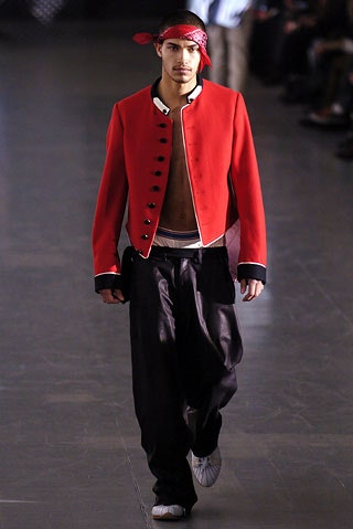 red fitted jacket with black pants