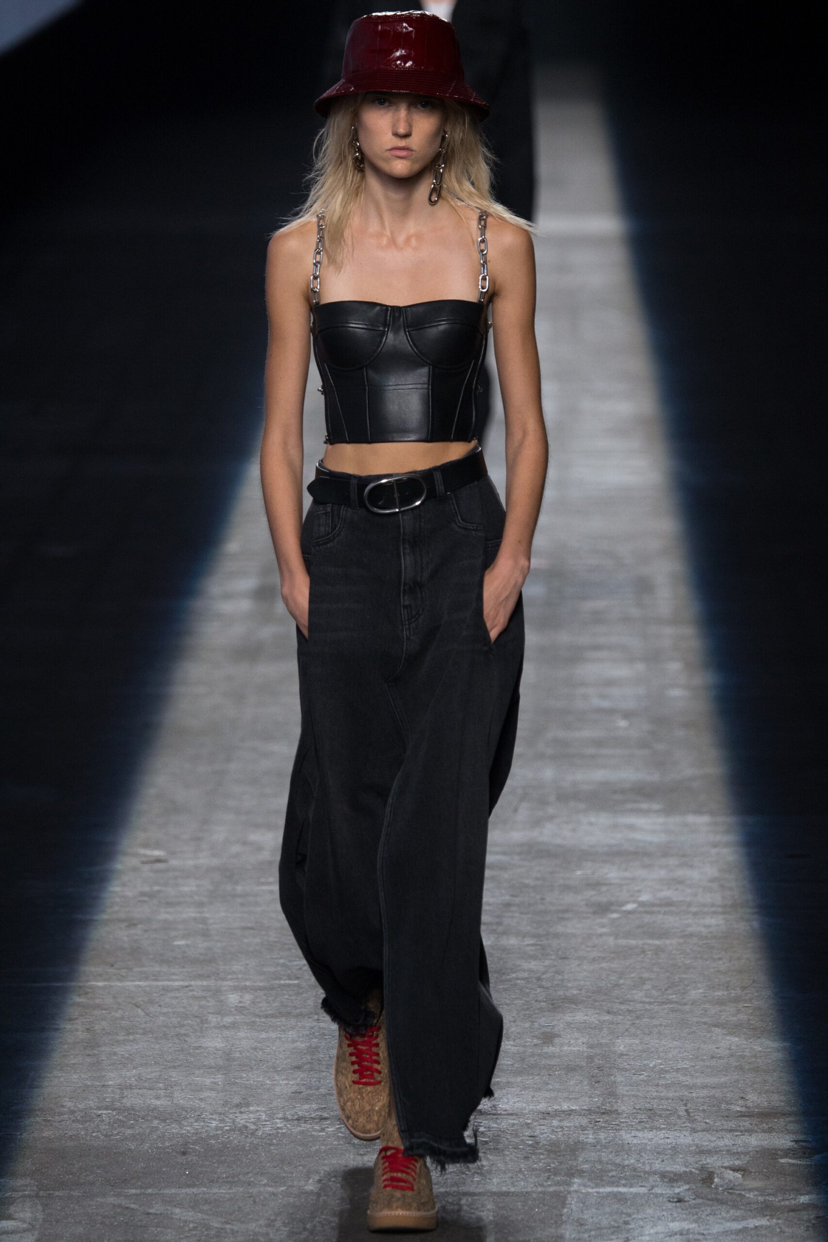 black leather bustier and relaxed pants