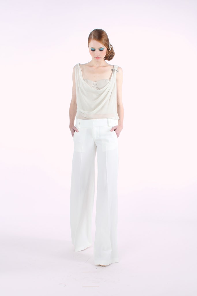 beige silk sleeveless top and white tailored pants