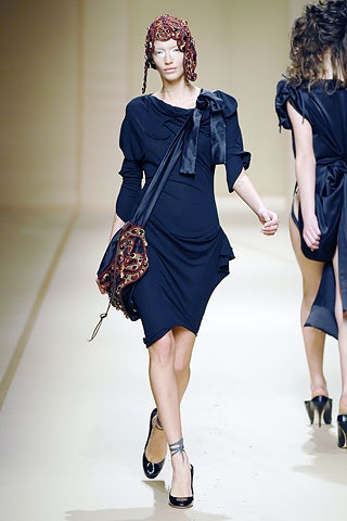 black fitted mini dress with embellished hat