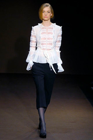 white fitted blouse and black tailored pants