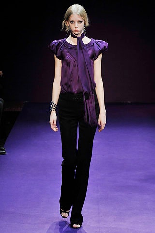 purple silk fitted top with black pants
