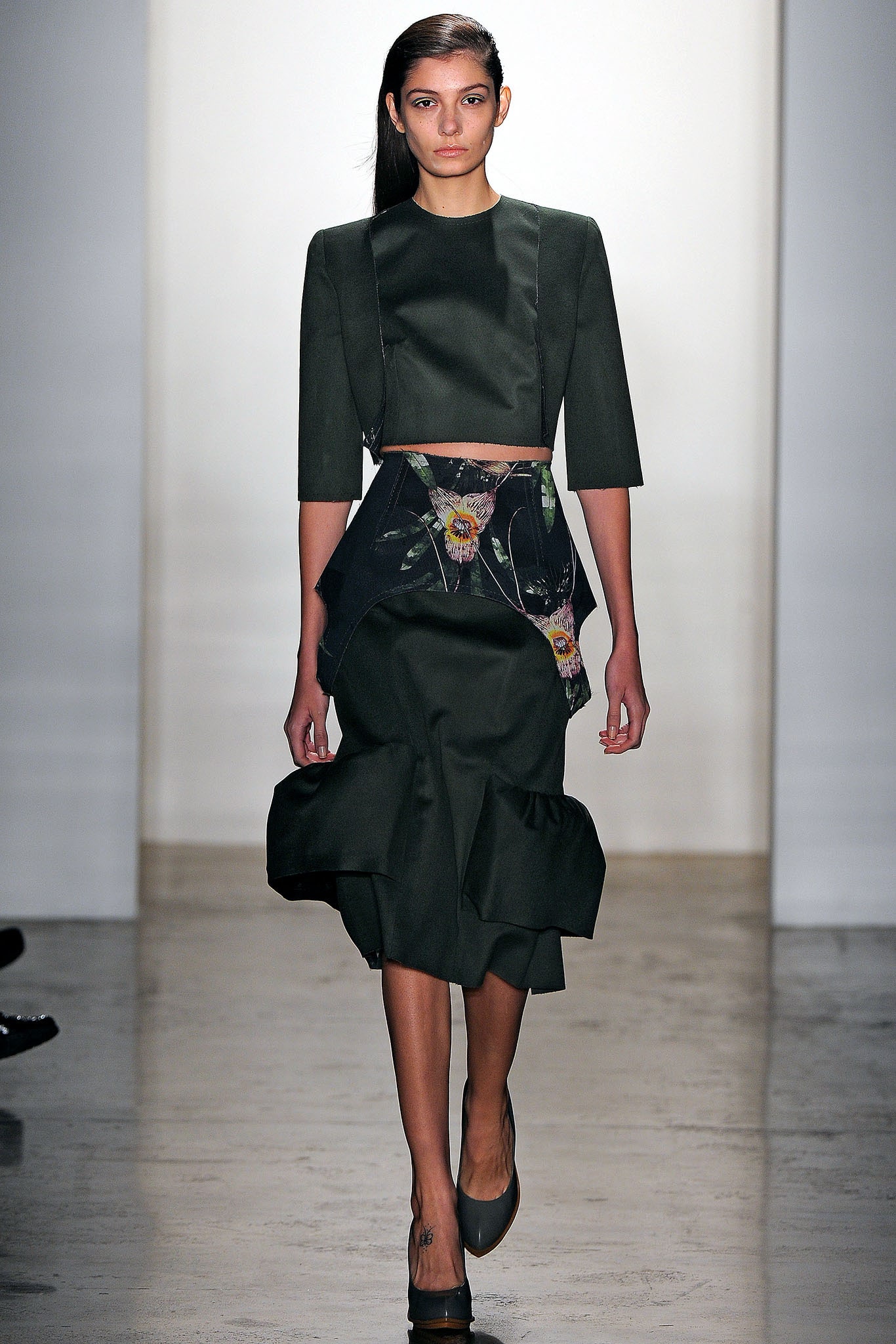 green fitted top and skirt