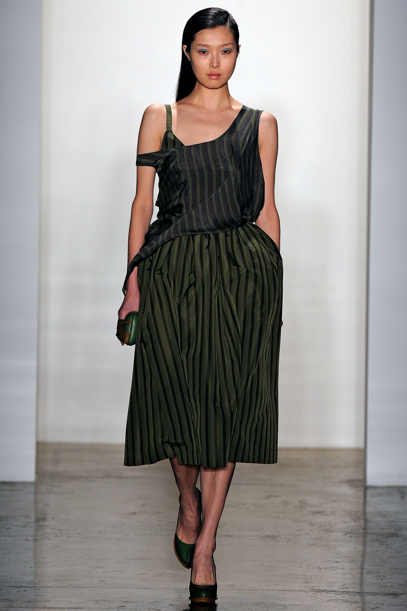 asymmetric green striped top and pleated midi skirt