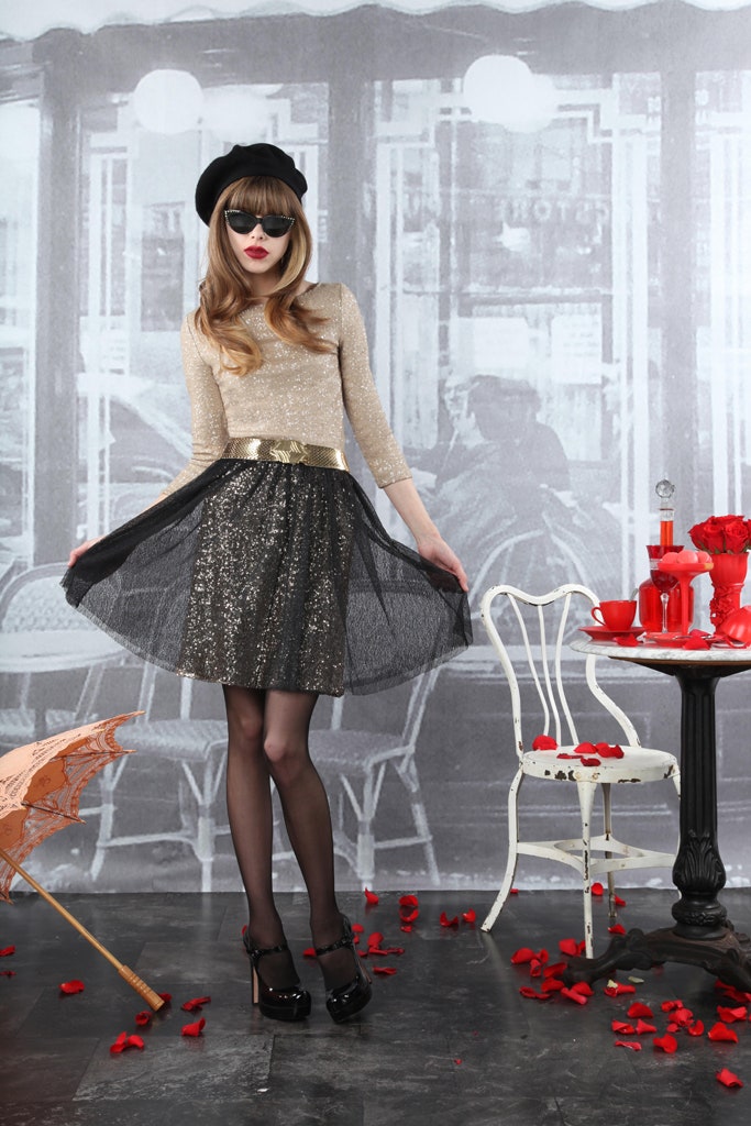 gold sequined top with black skirt
