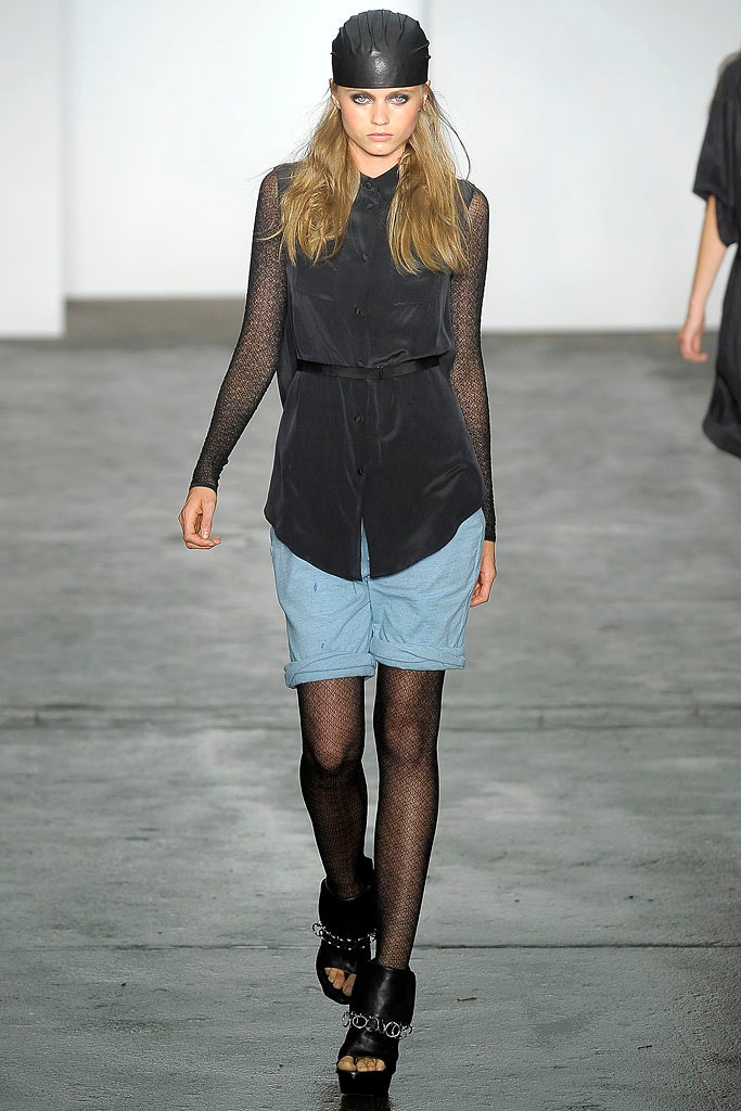 black shirt blue denim shorts