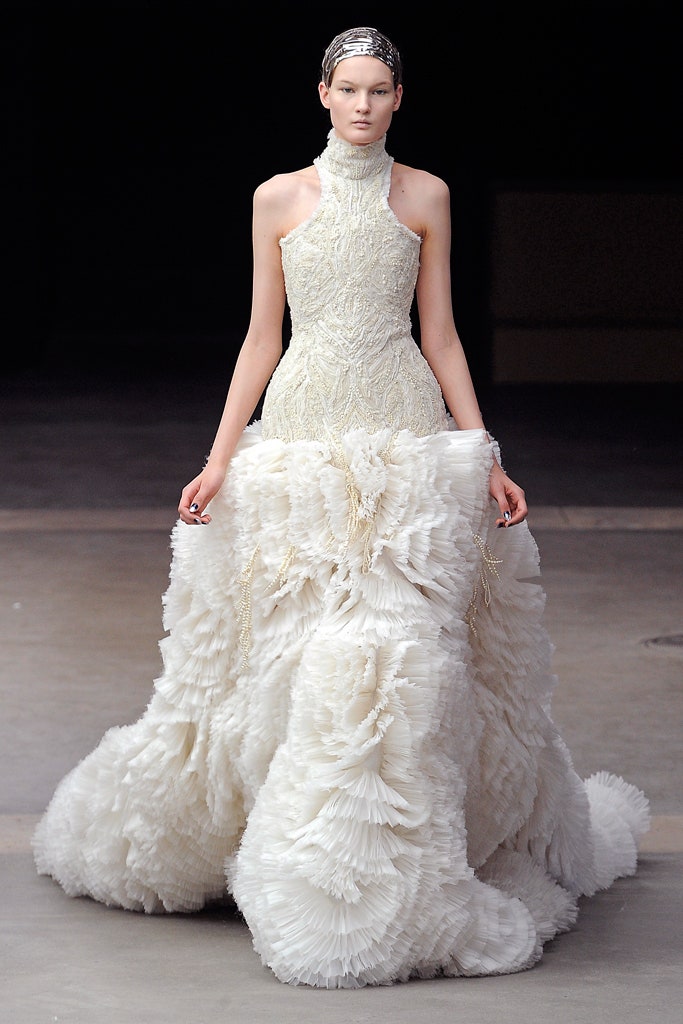 white pleated sleeveless gown