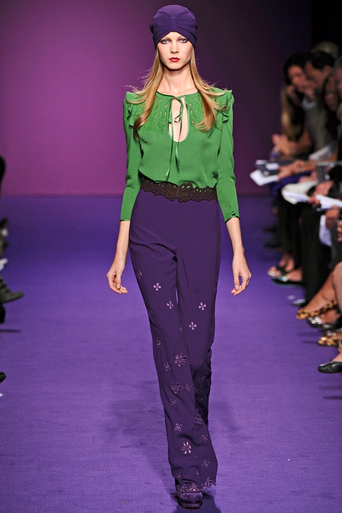 green ruffled blouse with purple pants