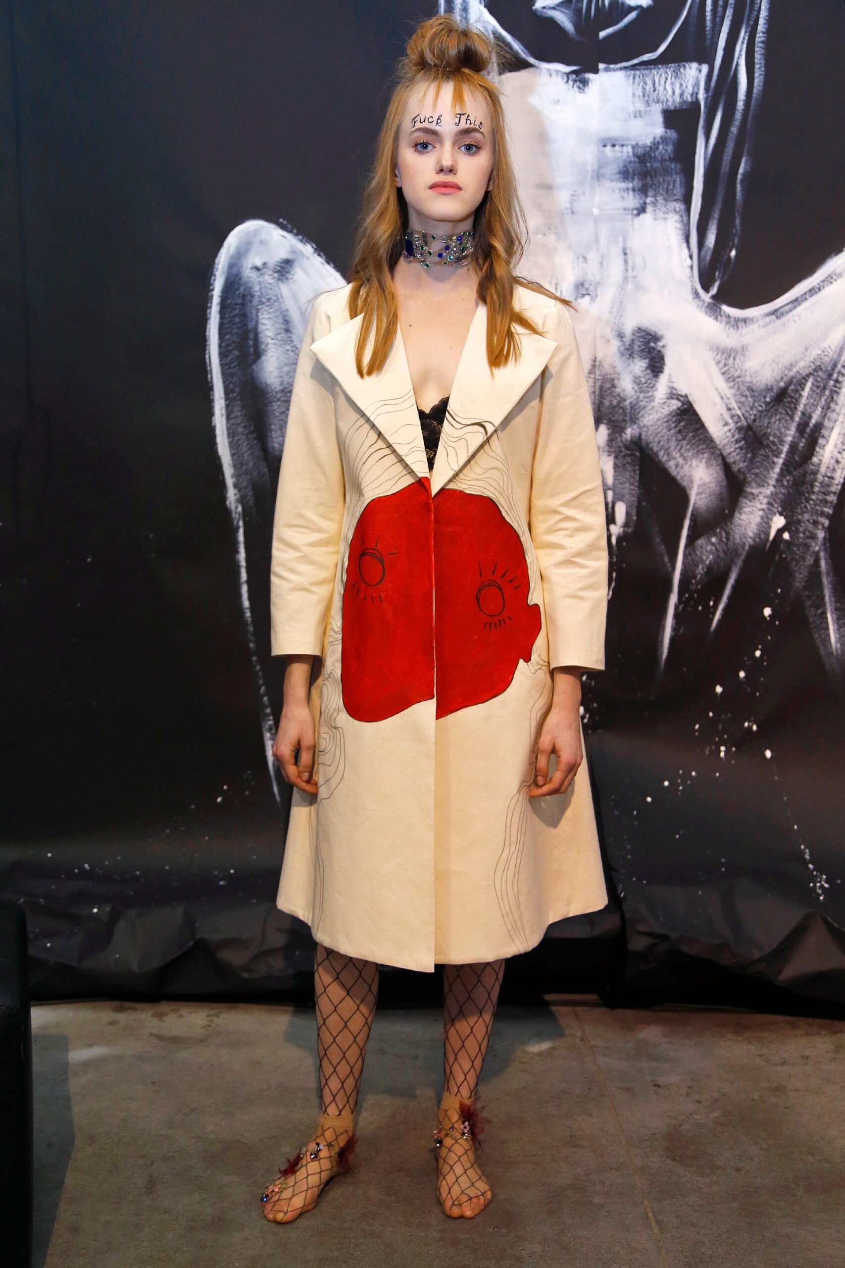 beige coat with red details