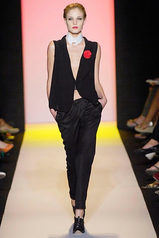 black fitted vest and relaxed pants