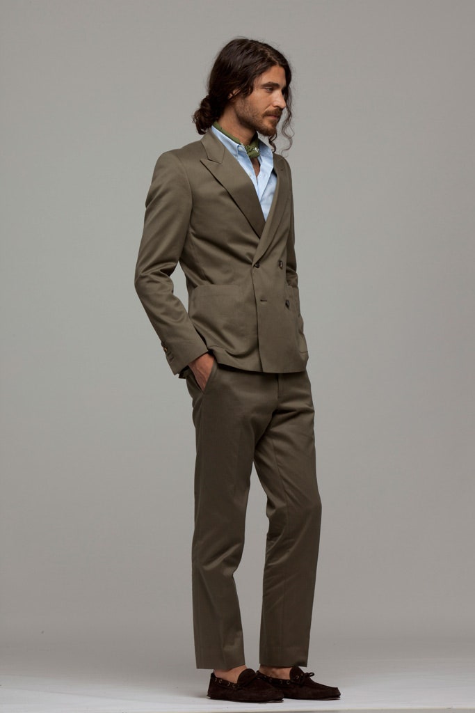 beige tailored suit with blue shirt