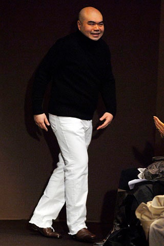 black wool turtleneck sweater and white pants