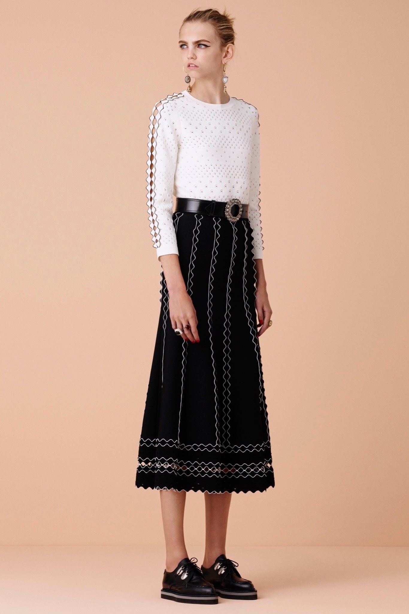 white embroidered top black midi skirt
