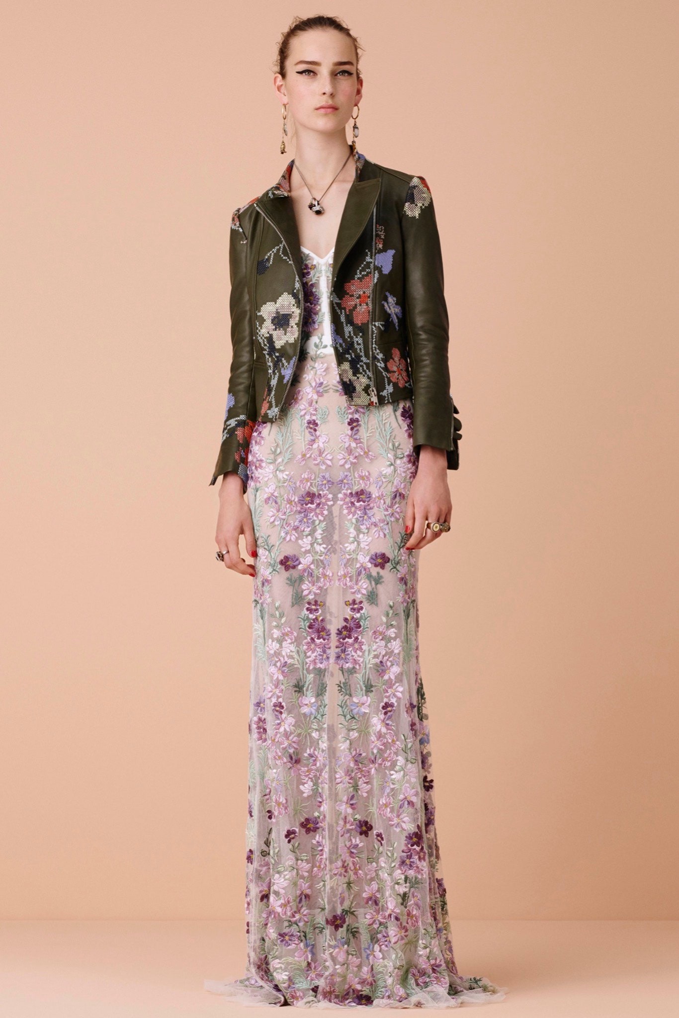 green leather jacket and floral gown