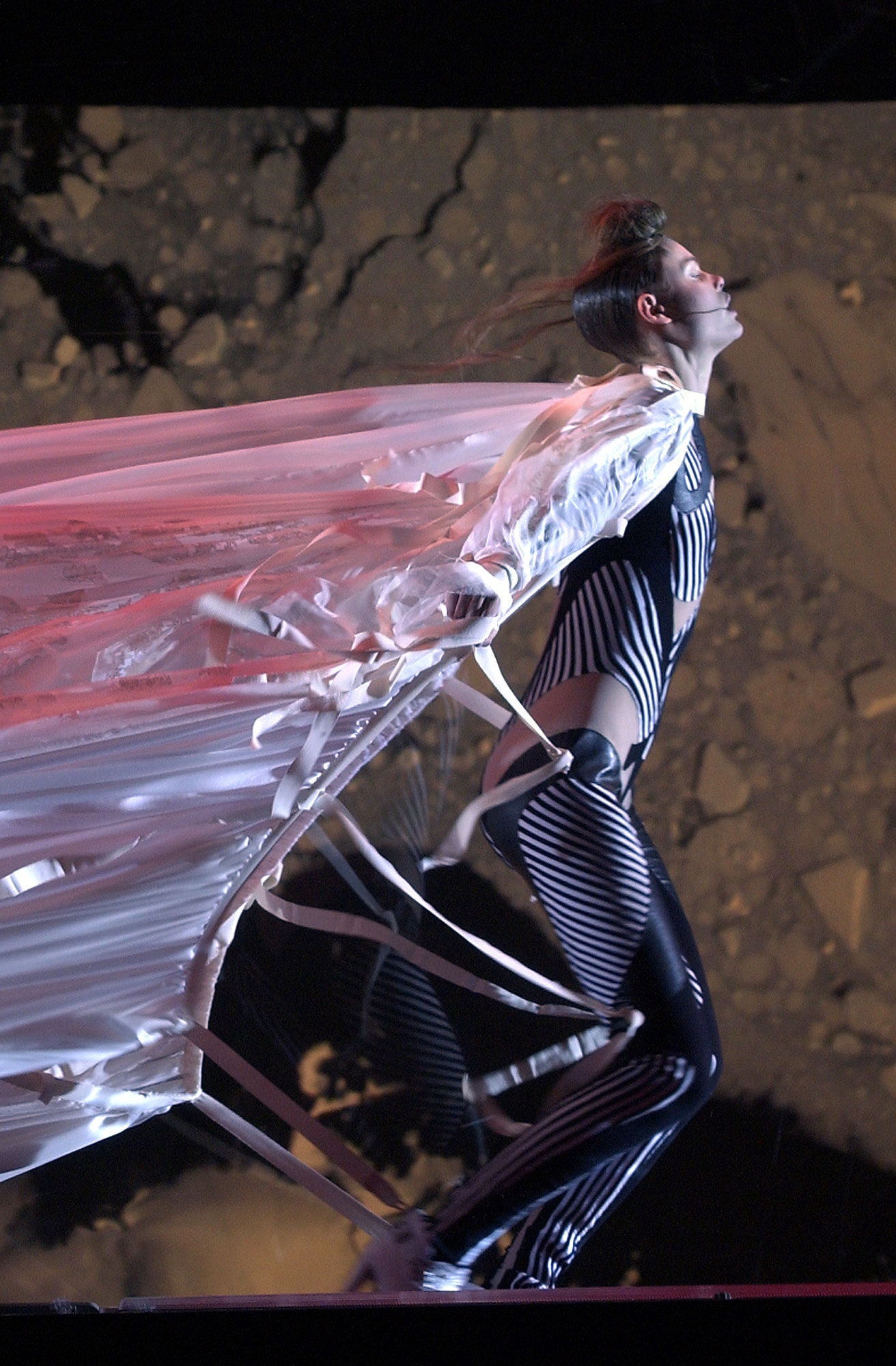 black and white striped catsuit with silk cape