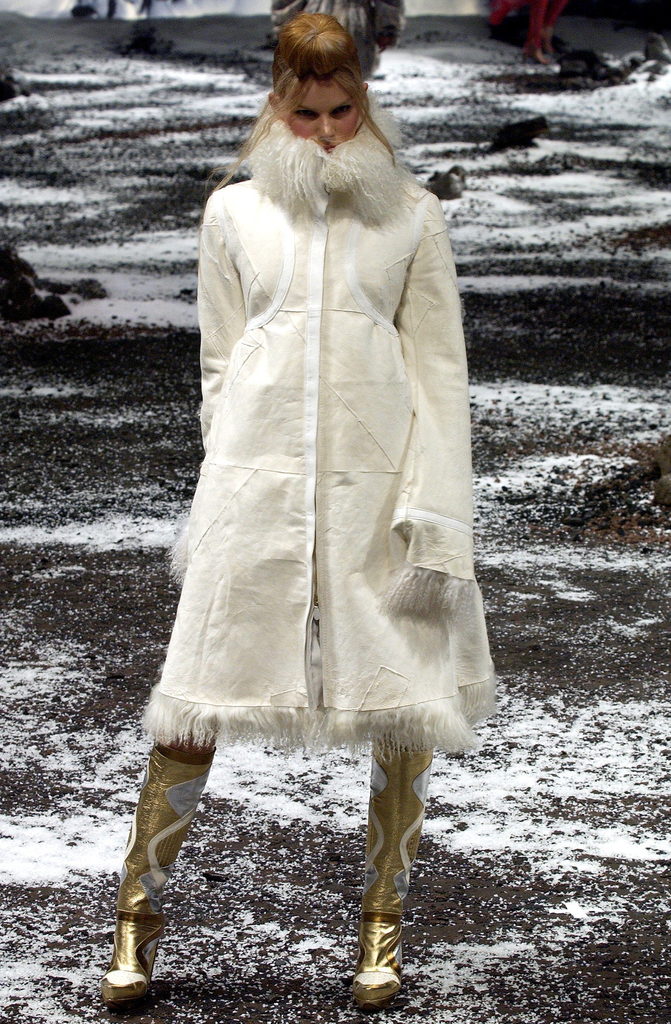 white relaxed coat with gold boots