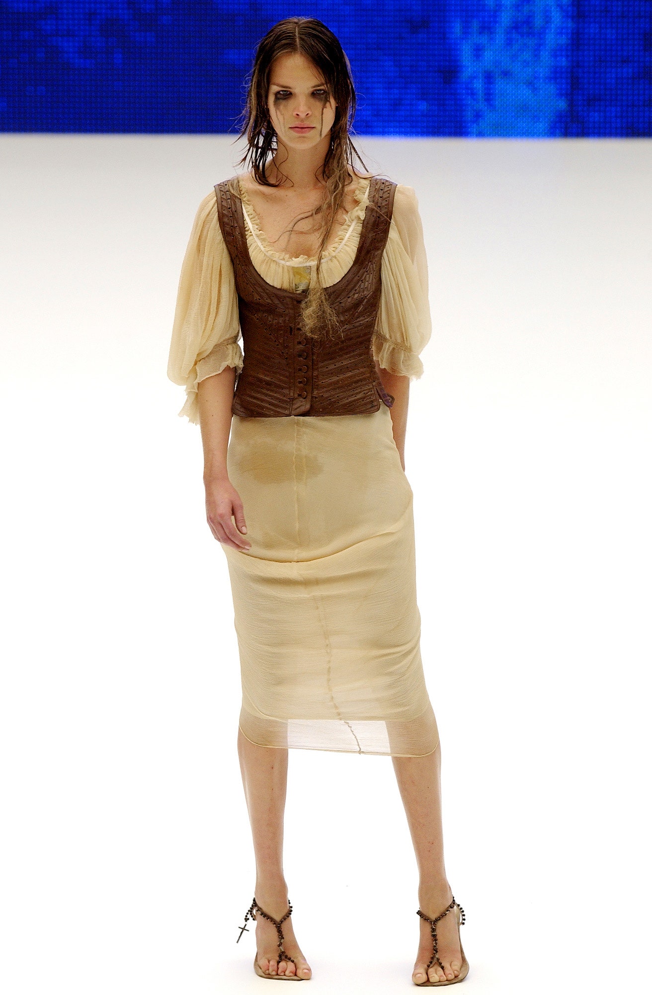 brown leather sleeveless fitted buttoned vest