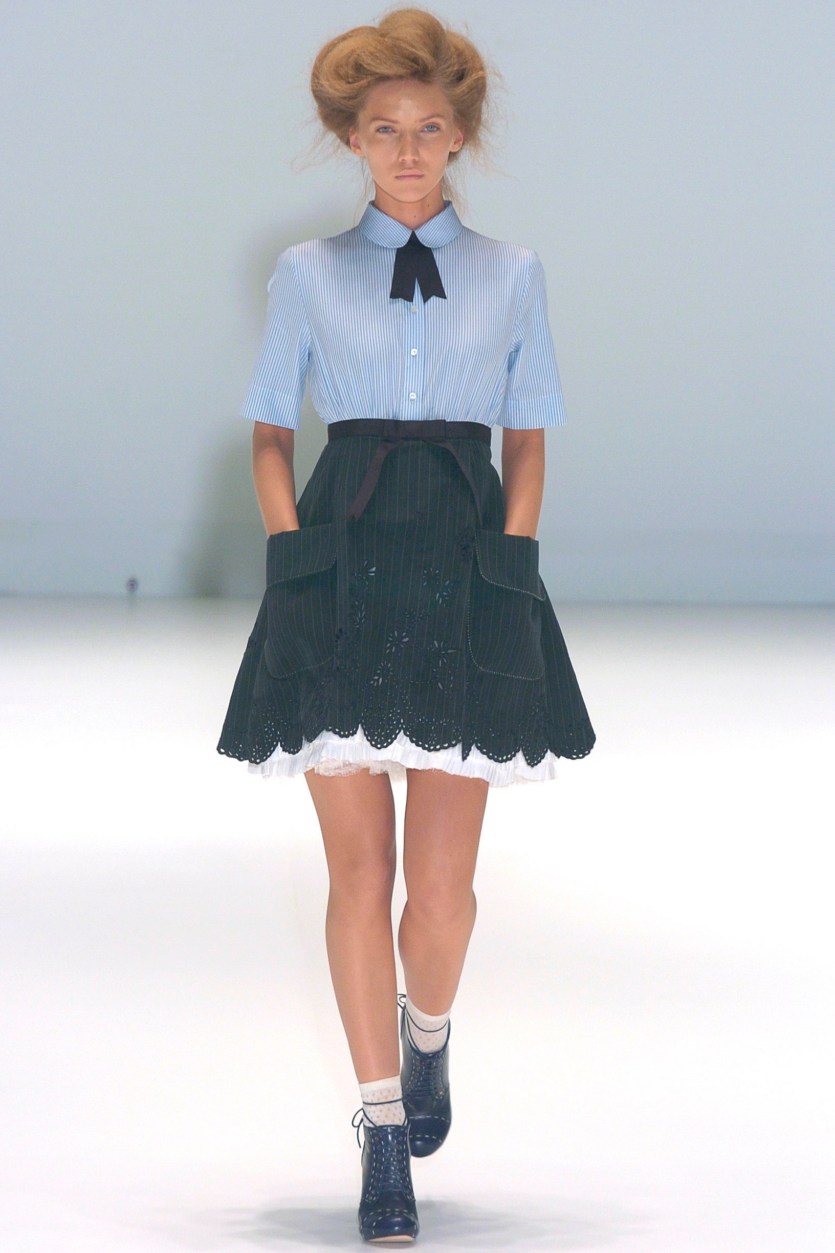 blue striped shirt and black skirt