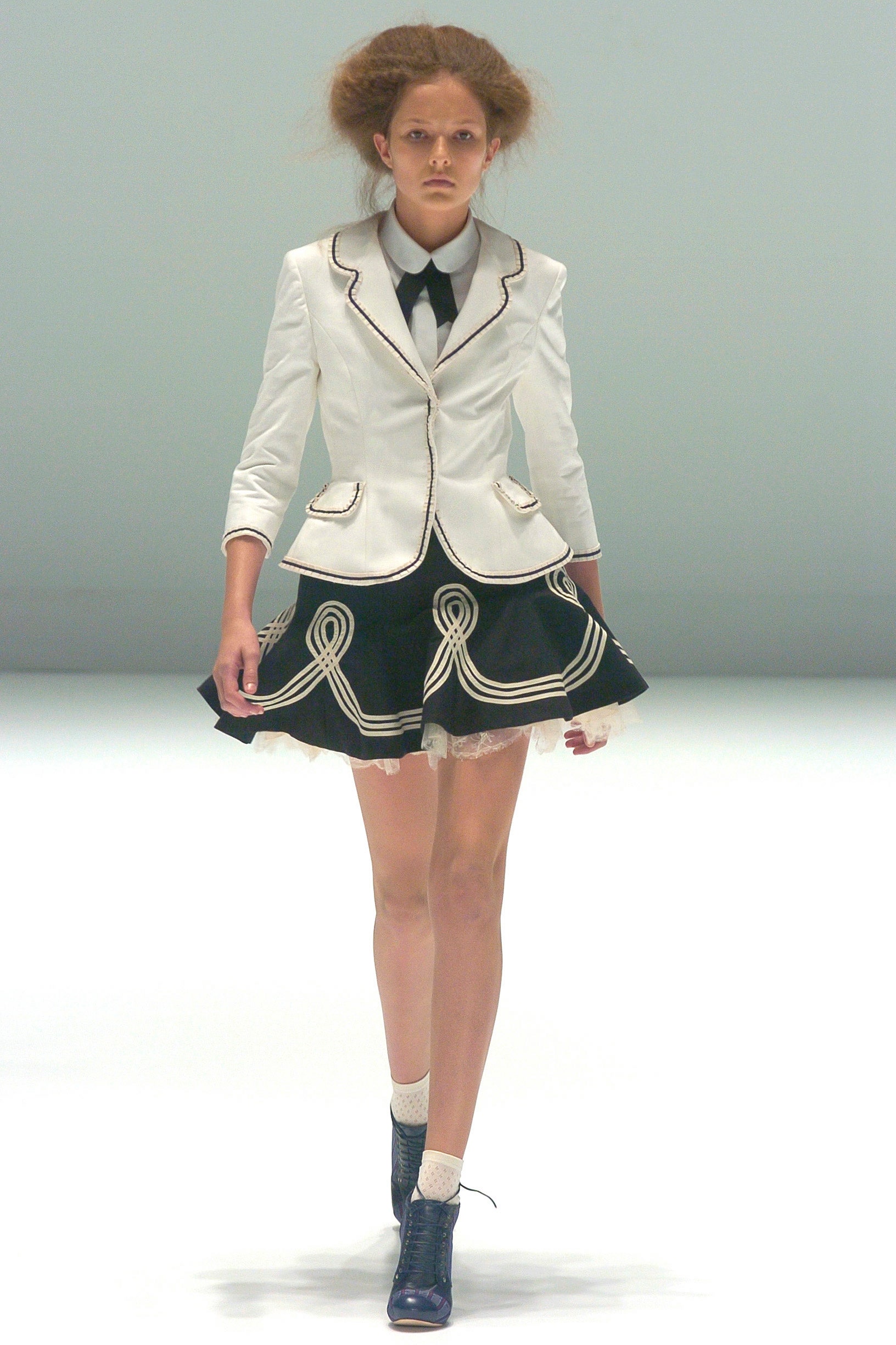 fitted white blazer and black mini skirt