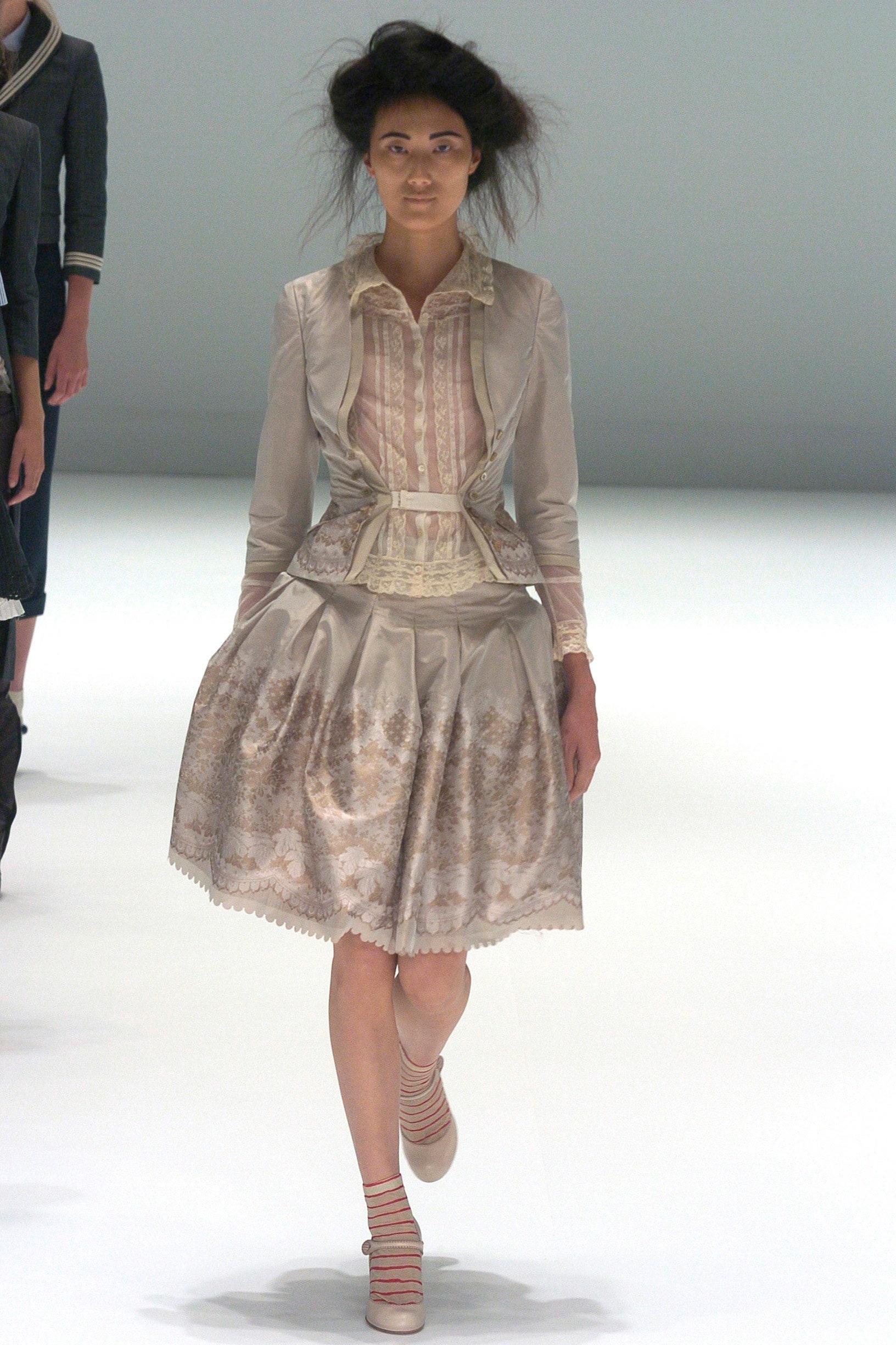 beige silk fitted blouse and skirt