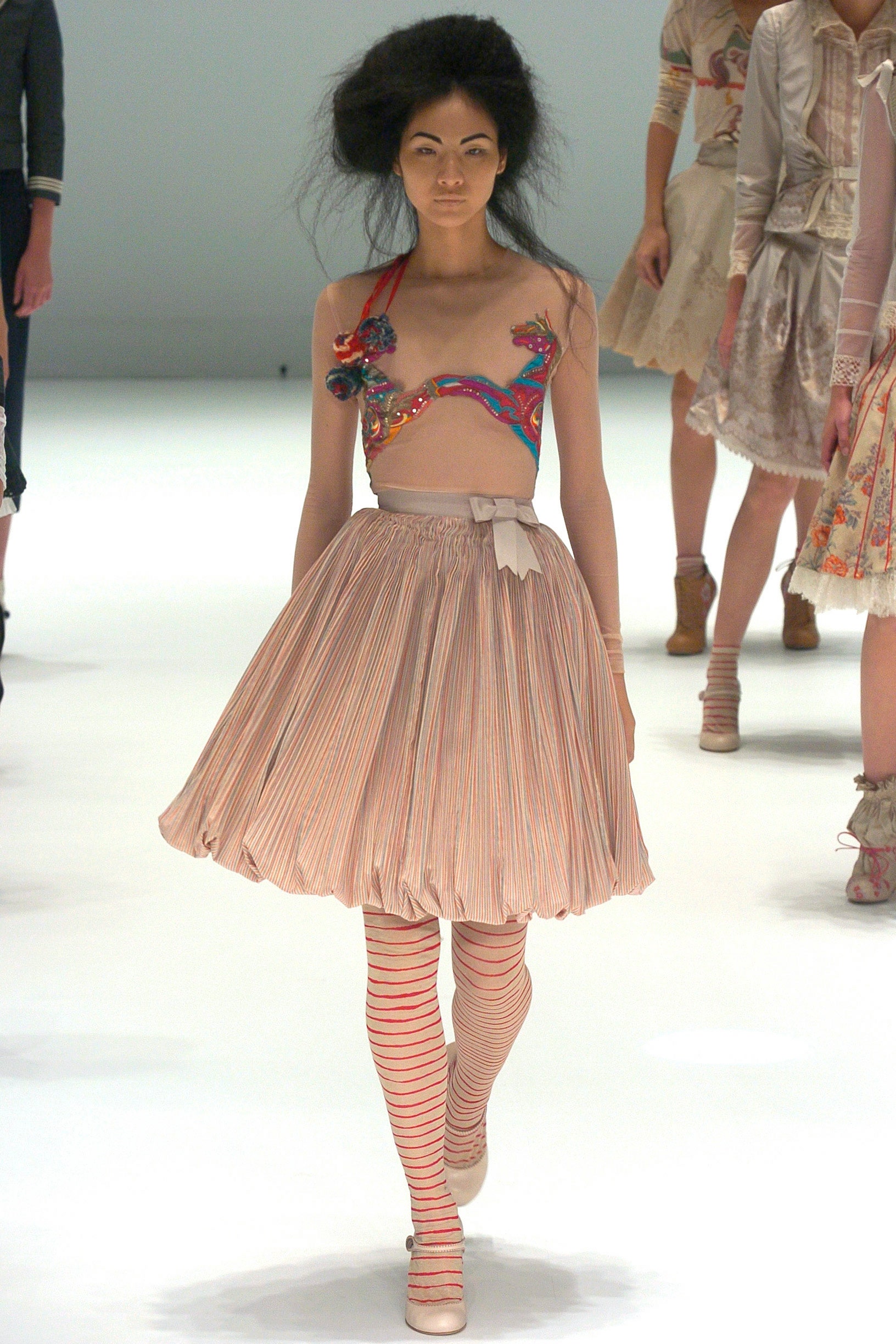 multi-colored embroidered top with pleated skirt