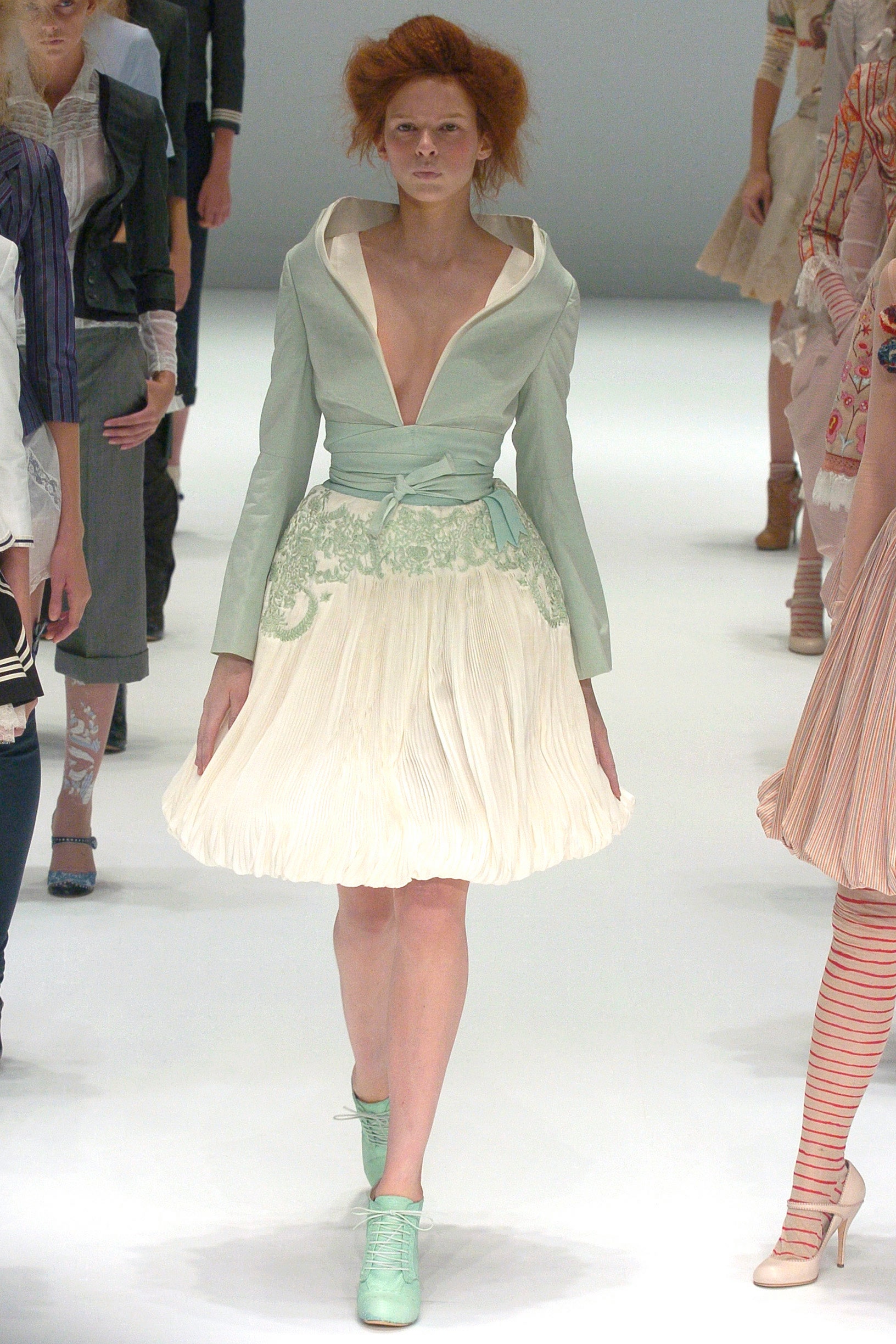 mint silk blouse and white pleated skirt